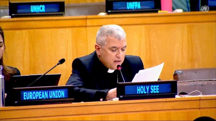 Archbishop Christophe El Kassis reads a statement at a United Nations committee table, behind a "Holy See" nameplate.